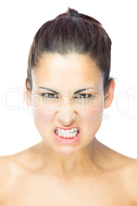 Front view of upset young woman gazing at camera