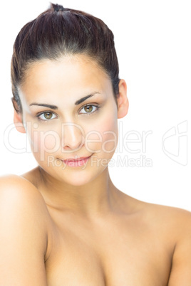 Side view of gorgeous brunette woman gazing at camera