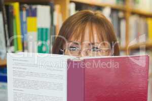 Mature female student reading a book