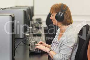 Female mature student working on computer