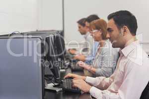 Mature students sitting in computer class