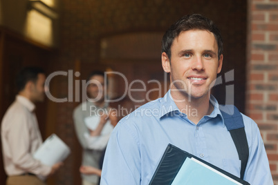 Mature male student posing in corridor