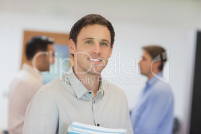 Handsome mature student posing in classroom