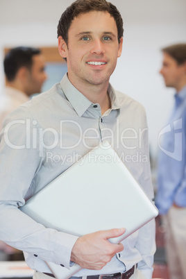 Attractive male mature student posing in classroom