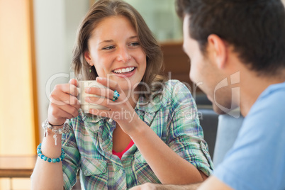 Two casual students having a cup of coffee