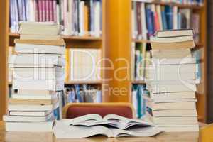 Stacks of books on desk