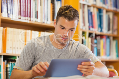 Attractive casual student using tablet