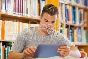 Attractive casual student using tablet