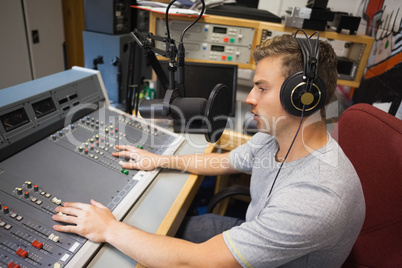 Handsome focused radio host moderating