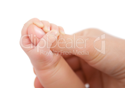 Baby hand holding mother finger