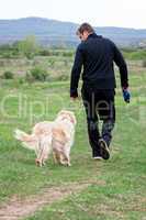 Young man walking with your dog
