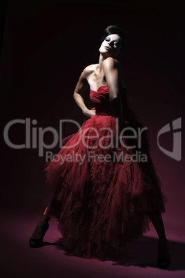 young sexy woman in a red evening dress
