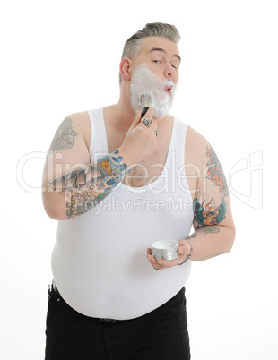 fat  man with shaving foam in the face