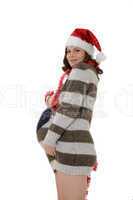 smiling pregnant woman with santa claus head