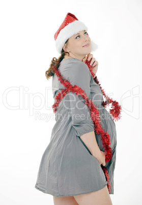 smiling pregnant woman with santa claus head
