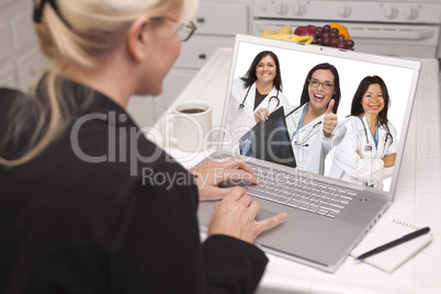 woman using laptop viewing three doctors with thumbs up