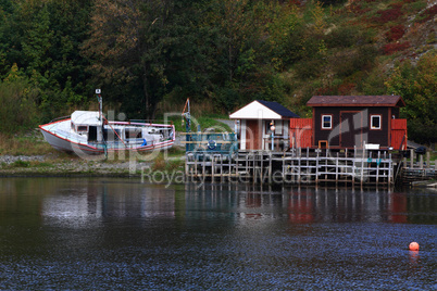 Winterized fishing dock and cabins in Quidi Vidi Harbor, Newfoundland.