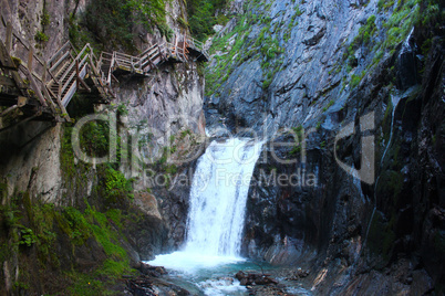 cliffside steps near waterfall