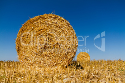 Straw bales in the light of sunset