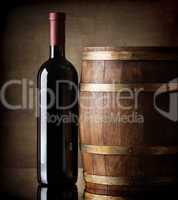 Bottle and wooden barrel