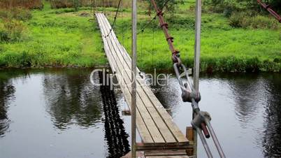 Hanging bridge and flowing water