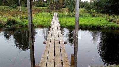 Four long wooden planks used to make hanging bridge