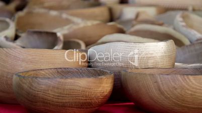 Wooden carved bowls all piled up
