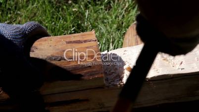 Chopping wood using an axe