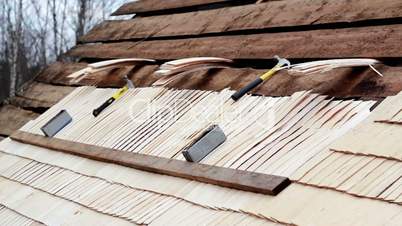 Unfinished cedar wooden shingle shake roofing repair