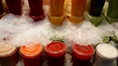 Natural colored juice on frozen jellies all packed and refrigerated surrounded by ice