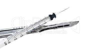scalpel and syringe