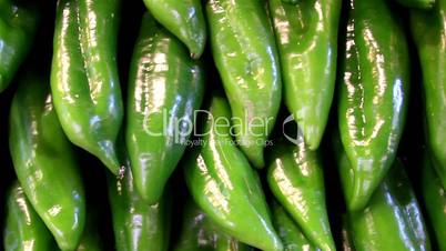 Big green sweet peppers paprika chilli pepper neatly piled