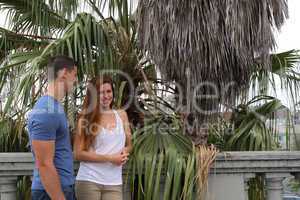 young couple palm tree