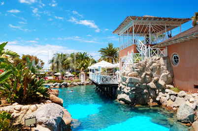 swimming pool near open-air restaurant at luxury hotel, tenerife
