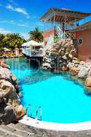 swimming pool near open-air restaurant at luxury hotel, tenerife