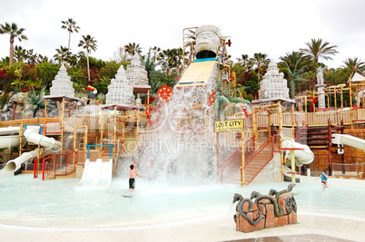 The kids playing in water attractions in Siam waterpark, Tenerife, Spain