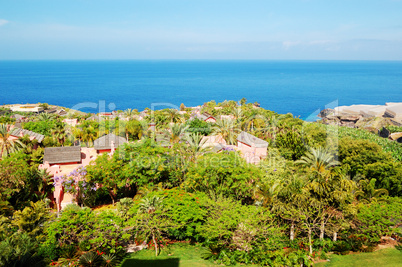 recreation area with villas of luxury hotel and banana's plantat