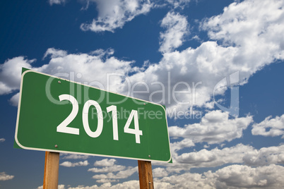 2014 green road sign over clouds