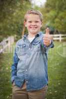 handsome young boy giving the thumbs up