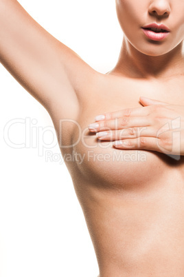 naked woman checking fro breast cancer