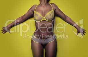 woman in lingerie on a yellow background