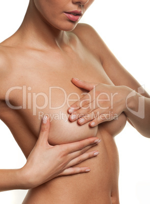 woman manipulating her breast in a cancer check