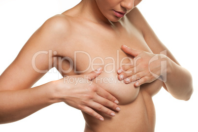 woman manipulating her breast in a cancer check