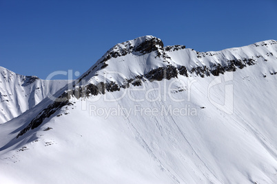 off piste slope with traces of avalanches