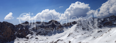 panorama of snow mountains in sunny day