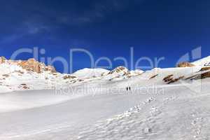 two hikers on snow plateau