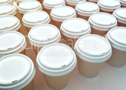 a row of paper coffee cups on a white background.