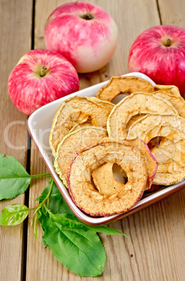 apples fresh and dried red in a bowl on the board