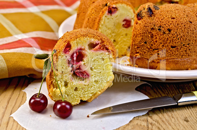 cake with berries cherries and napkin on the board