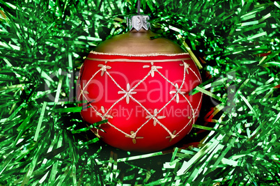 christmas red ball on the green tinsel